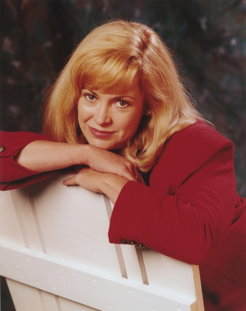 Catherine Hicks posed on Chair Photo Print - Item # VARCEL699312