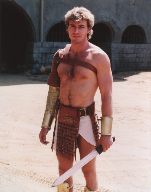 Jon-Erik Hexum wearing a Gladiator Costume with a Blade in a Close Up Portrait Photo Print - Item # VARCEL699303