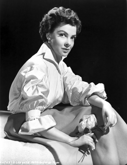 Kathryn Grayson on Silk Top Sitting While Holding Flowers Photo Print - Item # VARCEL699362