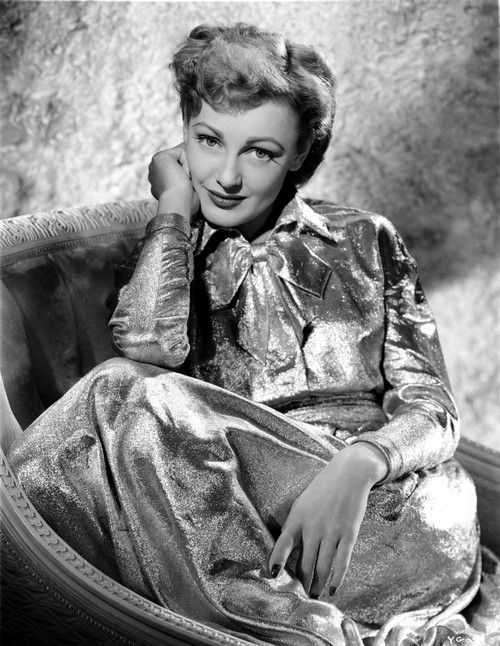 Virginia Grey sitting on a Chair in Shiny Dress Photo Print - Item # VARCEL699453