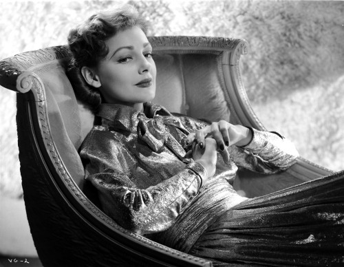 Virginia Grey in a Shiny Dress sitting on a Chair Photo Print - Item # VARCEL699457