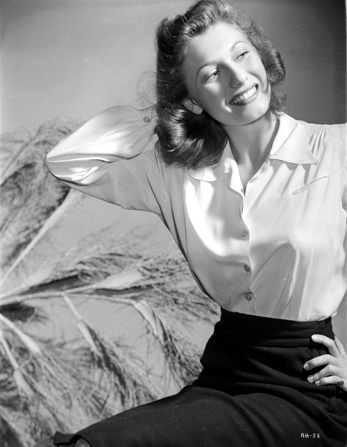 Anne Baxter on Printed Top sitting and smiling Photo Print - Item # VARCEL699853