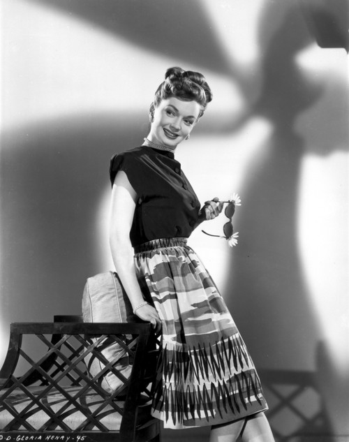 Gloria Henry on a Printed Skirt Leaning on a Chair Portrait Photo Print - Item # VARCEL699886