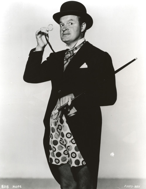 Bob Hope standing wearing Tuxedo with Hat while Holding Magician Stick and Eyeglasses Photo Print - Item # VARCEL699924