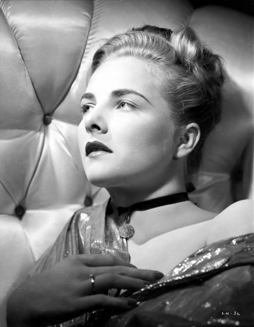 Leza Holland on a Silk Top Lying on a Couch Portrait Photo Print - Item # VARCEL699997