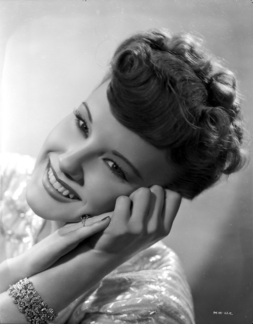 Martha Holliday on a Shiny Top and Face Leaning on Both Hands Portrait Photo Print - Item # VARCEL700075