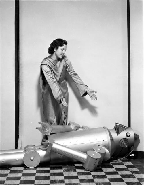 Lois January Helping the Robot to Get Up Photo Print - Item # VARCEL700486