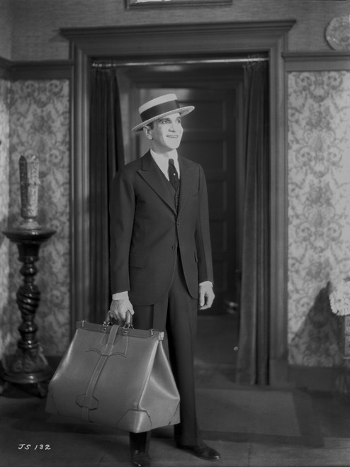 Al Jolson Leaving with a Big Bag wearing a Black Suit and a Hat Classic Movie Scene Photo Print - Item # VARCEL700670