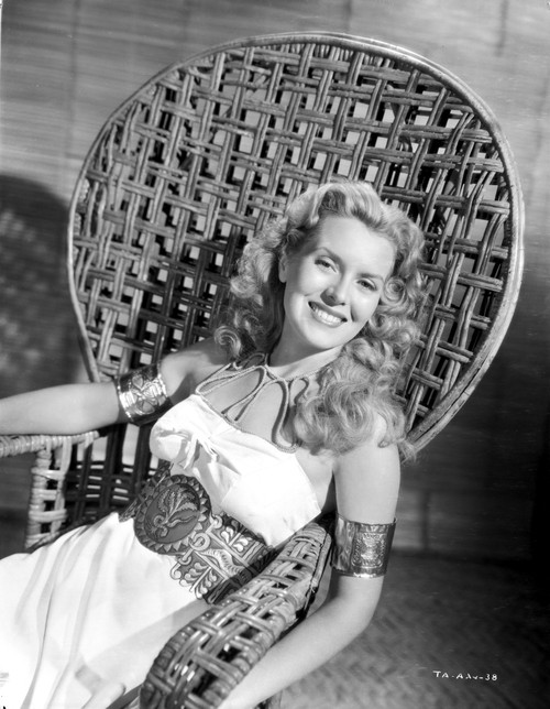 Brenda Joyce sitting on a Handcrafted Chair and smiling Photo Print - Item # VARCEL700704