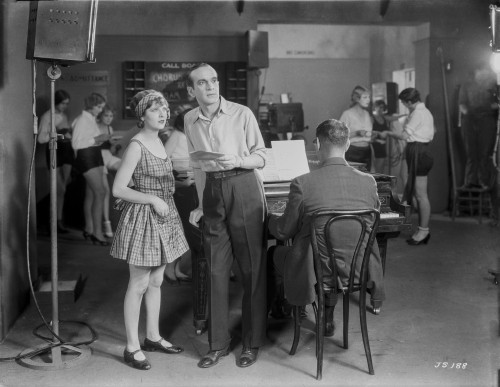 Al Jolson standing with a Woman Near the Piano in a Classic Movie Scene Photo Print - Item # VARCEL700736