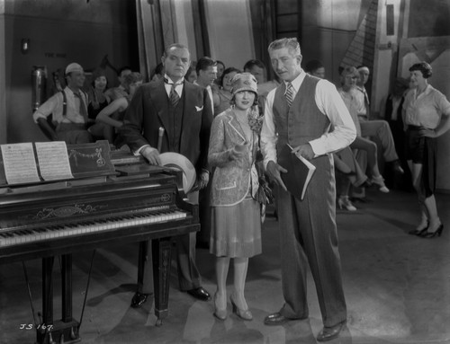 Al Jolson Discussing with His Group Near the Piano Photo Print - Item # VARCEL700741
