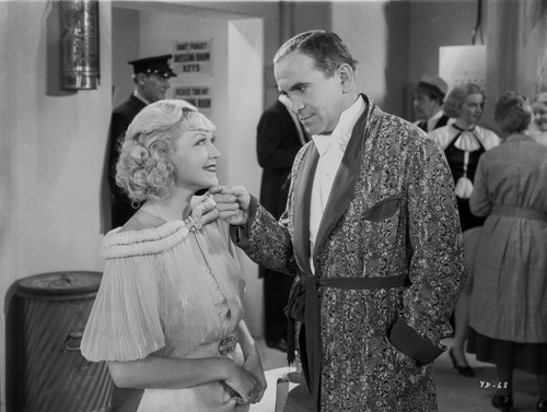 Al Jolson Hitting on the Woman in White Dress in a Classic Movie Scene Photo Print - Item # VARCEL700784