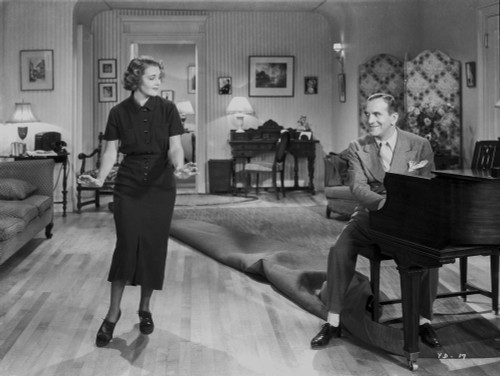 Al Jolson Playing a Piano While the Girl is Dancing in a Classic Movie Scene Photo Print - Item # VARCEL700812