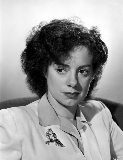 Elsa Lancaster on a Blazer with a Brooch and sitting Photo Print - Item # VARCEL701031