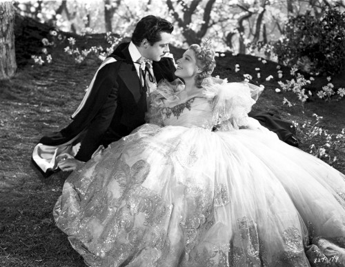 Miliza Korjus on an Embroidered Gown Leaning on a Man Photo Print - Item # VARCEL701007