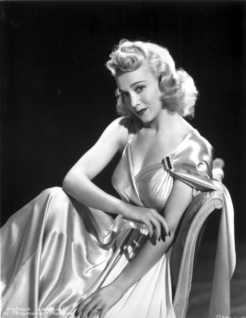 Carole Landis on a Silk Dress sitting and posed Photo Print - Item # VARCEL701100