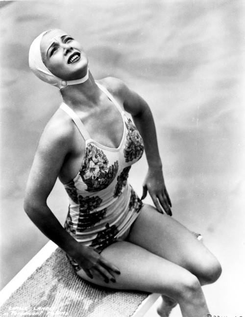Carole Landis on a Swimsuit sitting on a Dive Board Photo Print - Item # VARCEL701110