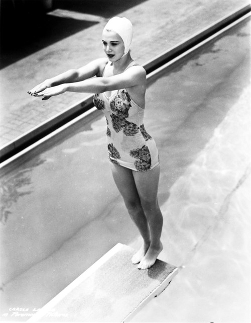 Carole Landis on a Printed Swimsuit and standing on a Dive Board Photo Print - Item # VARCEL701112