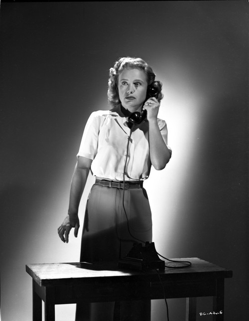 Priscilla Lane Answering a Telephone Pose Photo Print - Item # VARCEL701174