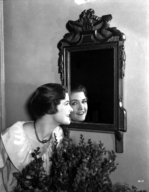 Laura La Plante smiling on a Mirror in a White Top Photo Print - Item # VARCEL701270
