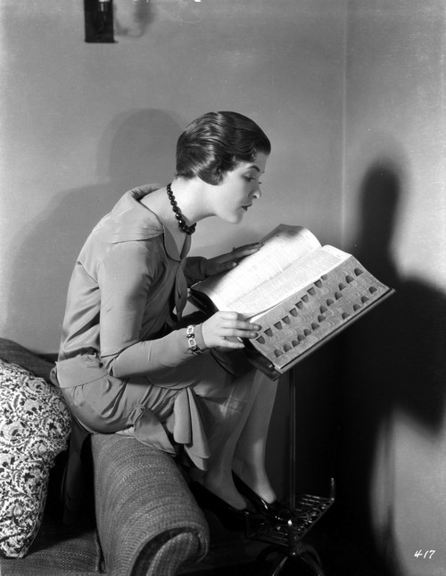 Laura La Plante sitting and Reading Photo Print - Item # VARCEL701276
