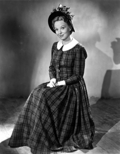 Anna Lee on a Printed Dress sitting and smiling Photo Print - Item # VARCEL701307