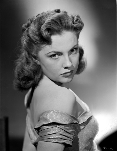 Joan Leslie on a Backless with a Silk Dress and posed Photo Print - Item # VARCEL701365