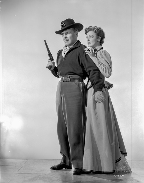 Slaughter Trail Man Protecting a Woman in a Movie Scene Photo Print - Item # VARCEL701402