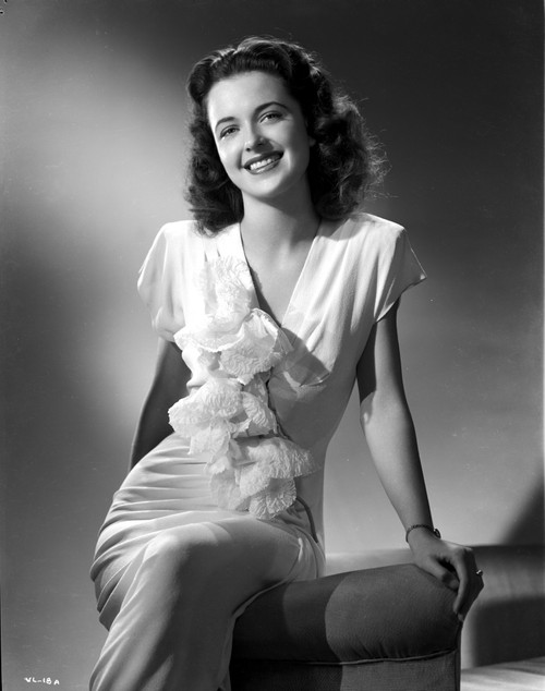 Vickie Lester on a Ruffled Dress sitting and smiling Photo Print - Item # VARCEL701416