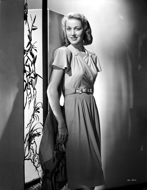 Audrey Long on a Silk Dress Leaning and smiling Photo Print - Item # VARCEL701494