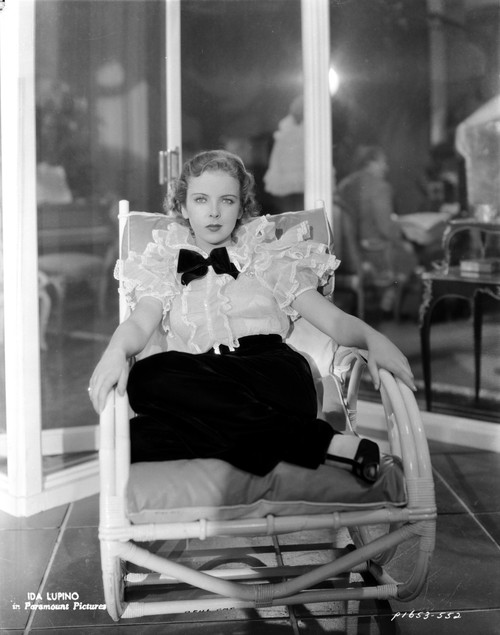Ida Lupino on a Ruffled Lace Top sitting and posed Photo Print - Item # VARCEL701548