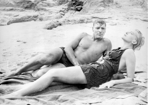 From Here To Eternity Man and Woman laying in Seashore Photo Print - Item # VARCEL701529