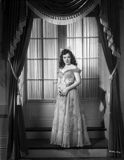 Marcy McGuire on an Embroidered Gown standing and posed Photo Print - Item # VARCEL701649