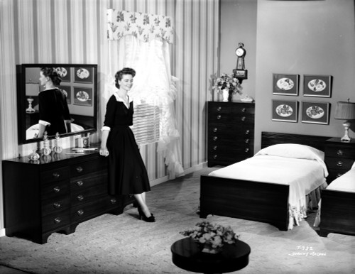 Dorothy Malone on a Dress in a Bedroom sitting and posed Photo Print - Item # VARCEL701735