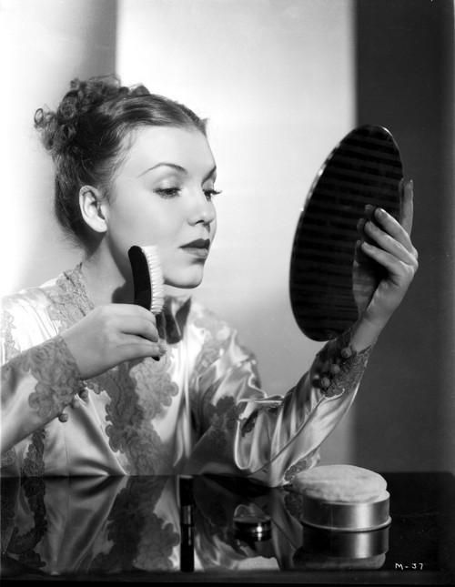 Margo Putting Powder on Face Portrait Photo Print - Item # VARCEL701787
