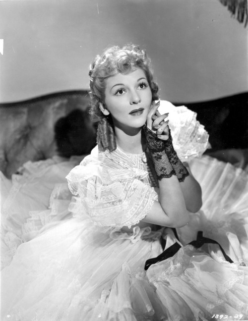 Mary Martin on a Ruffled Gown sitting on a Bed Photo Print - Item # VARCEL701899