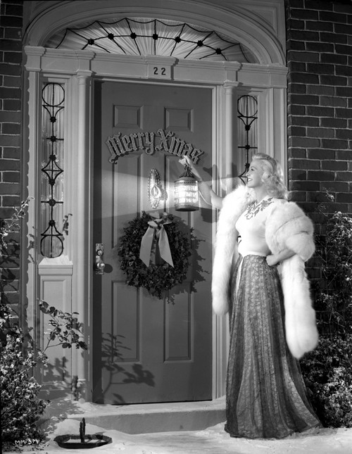 Marilyn Maxwell Knocking in Elegant Dress with Fur Shawl Photo Print - Item # VARCEL702050