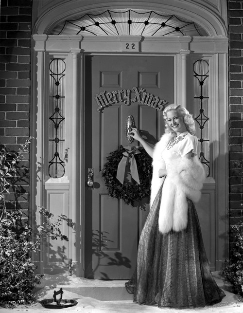 Marilyn Maxwell standing Outside the Door, wearing Black Dress with White Fur Shawl Photo Print - Item # VARCEL702048