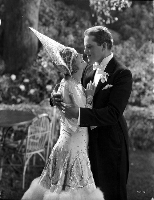 Marilyn Miller on a Beaded Gown and smiling To a Man Photo Print - Item # VARCEL702127
