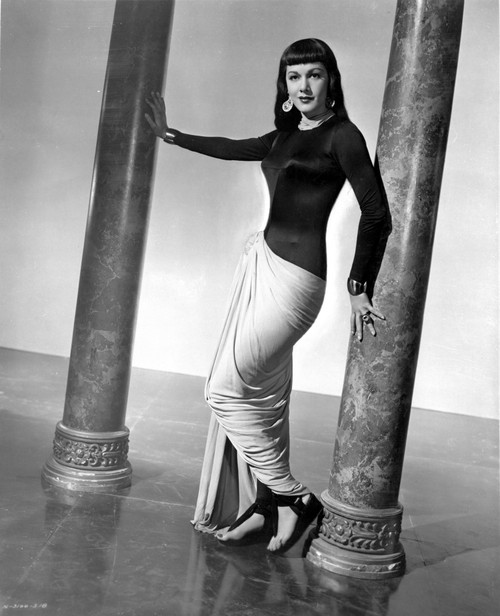 Maria Montez standing in Black and White Dress with Heels Photo Print - Item # VARCEL702202