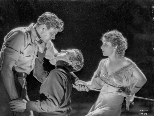 Most Dangerous Game Two Men Fighting and a Woman in Black Suit and a Dress Photo Print - Item # VARCEL702304