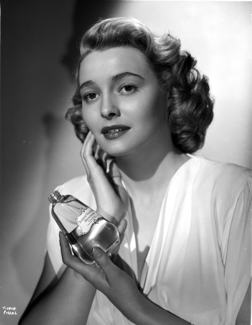 Patricia Neal Holding Perfume in Dress Photo Print - Item # VARCEL702527