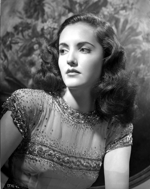 Joan Newton wearing a Glittering Cap-Sleeve Shirt Photo Print - Item # VARCEL702590