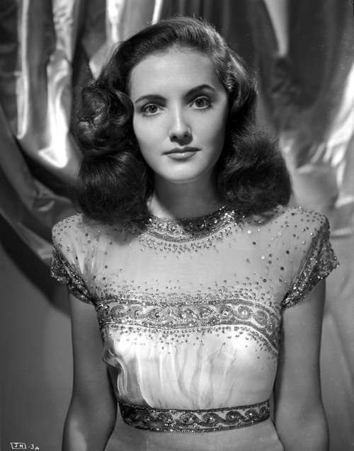 Joan Newton wearing a Glittering Cap-Sleeve Dress Photo Print - Item # VARCEL702592