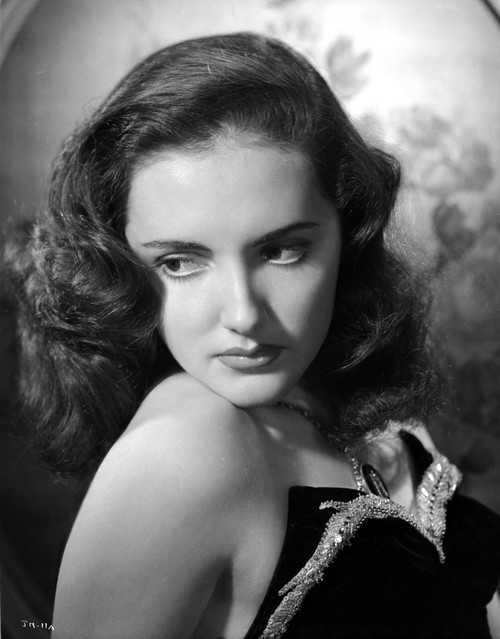 Joan Newton wearing a Strapless Black Dress in Portrait Photo Print - Item # VARCEL702610