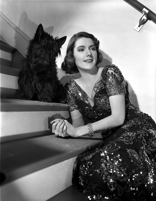 Barbara O'Neil on Embroidered Dress posed with Dog Photo Print - Item # VARCEL702705