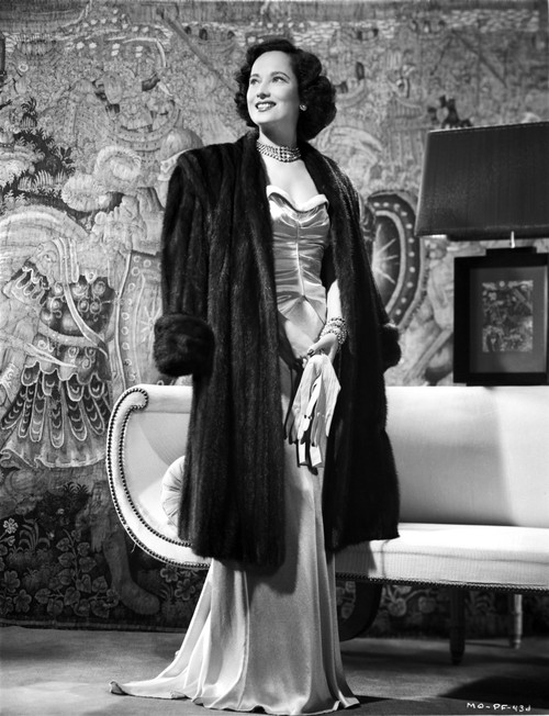 Merle Oberon on a Coat and Dress standing Photo Print - Item # VARCEL702806