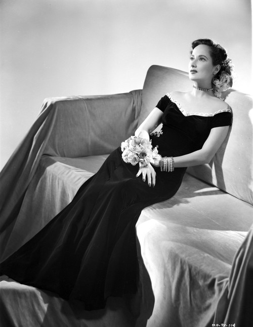 Merle Oberon on a Dress and sitting Photo Print - Item # VARCEL702788