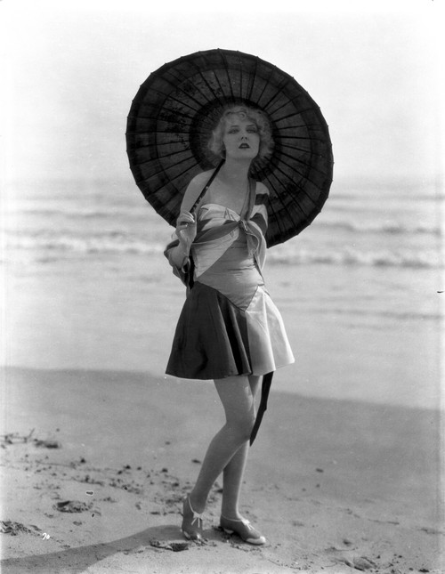 A Portrait Of Anita Page Carrying A Parasol at the Beach Photo Print - Item # VARCEL702863
