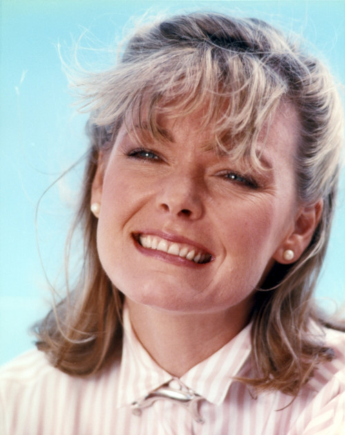 Jane Curtin Portrait in Beige Gingham Collar Shirt in Sky Blue Background Photo Print - Item # VARCEL688918